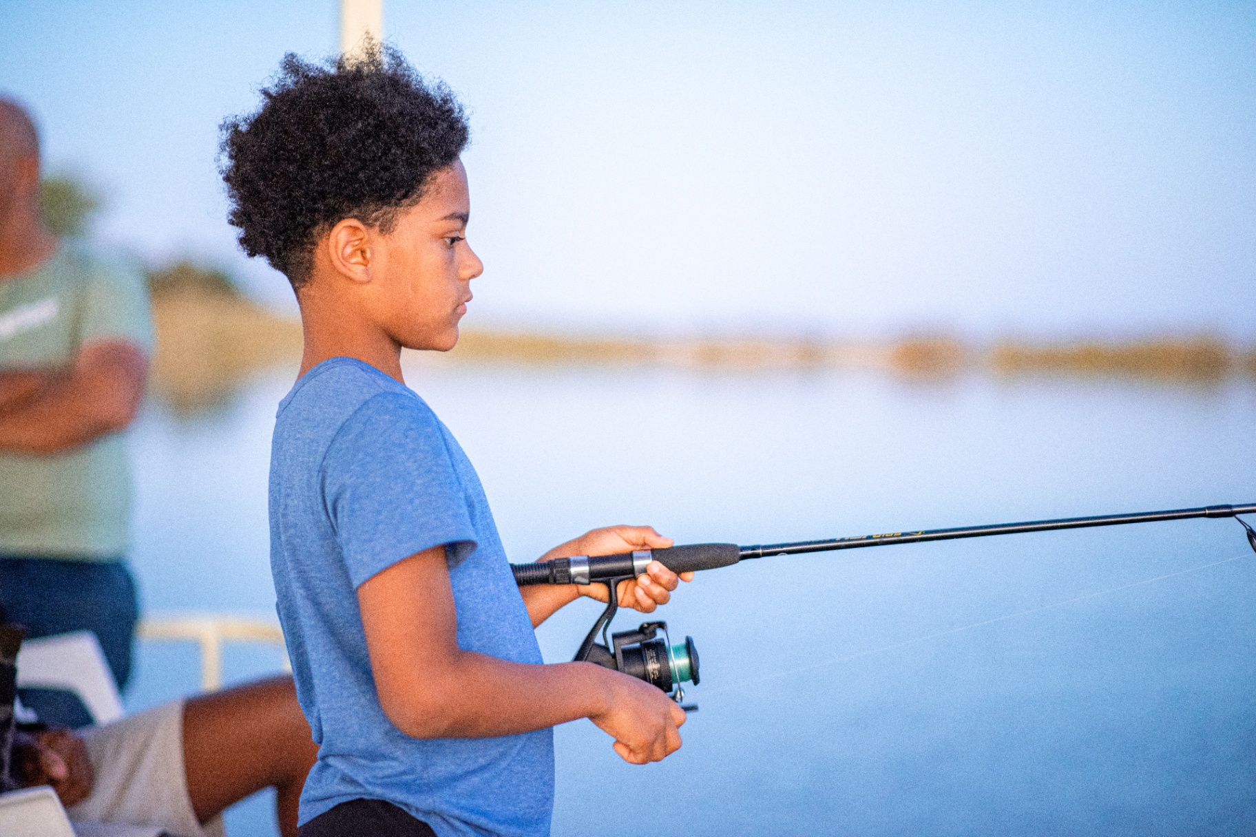 Kid fishing on the lake