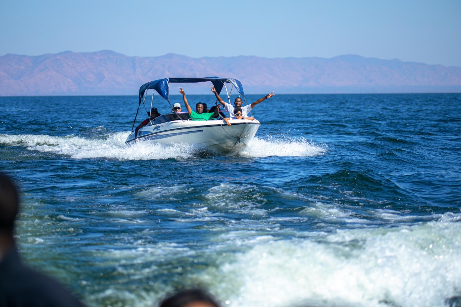 Excited guests on a fishing boat