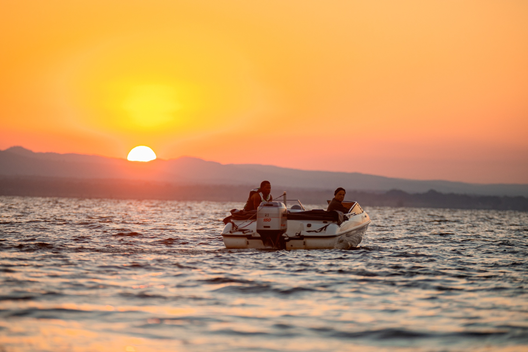 Sunset with a boat on the water