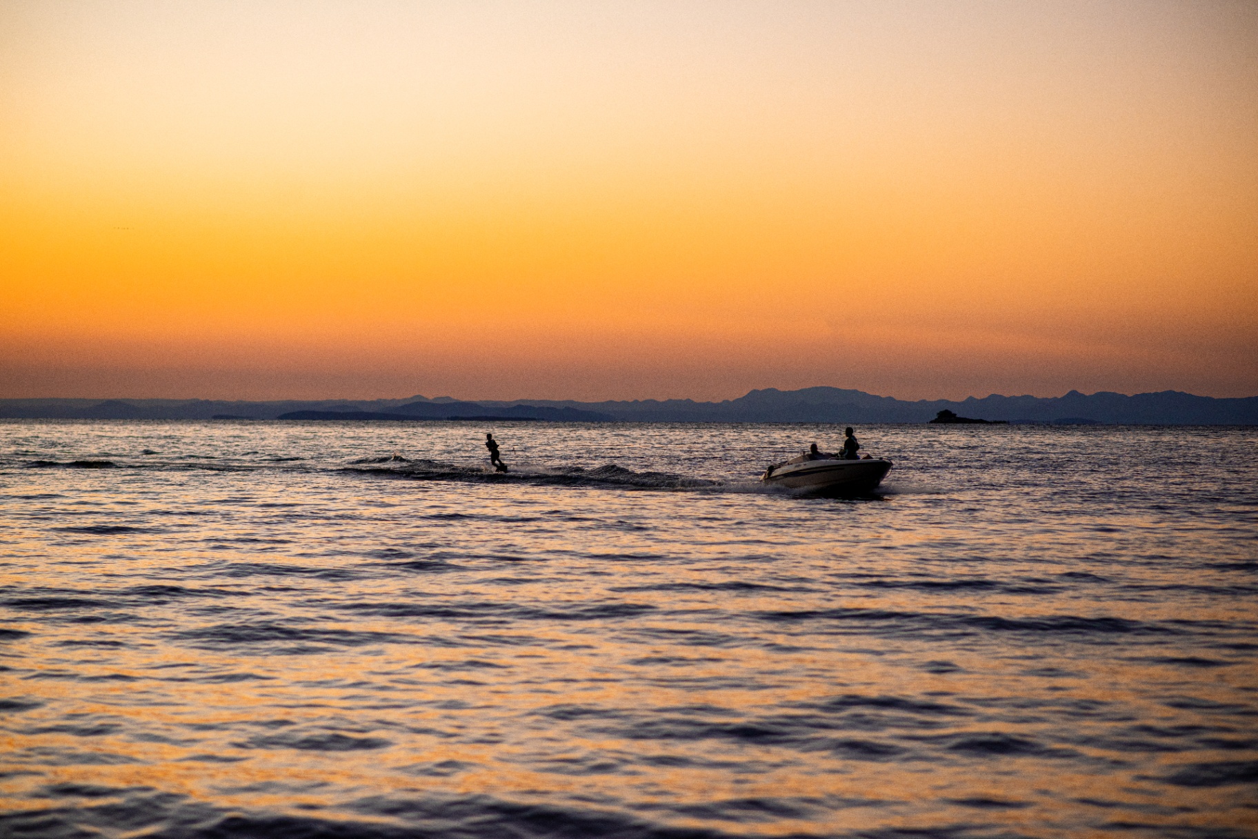 Wakeboarding with boat in view