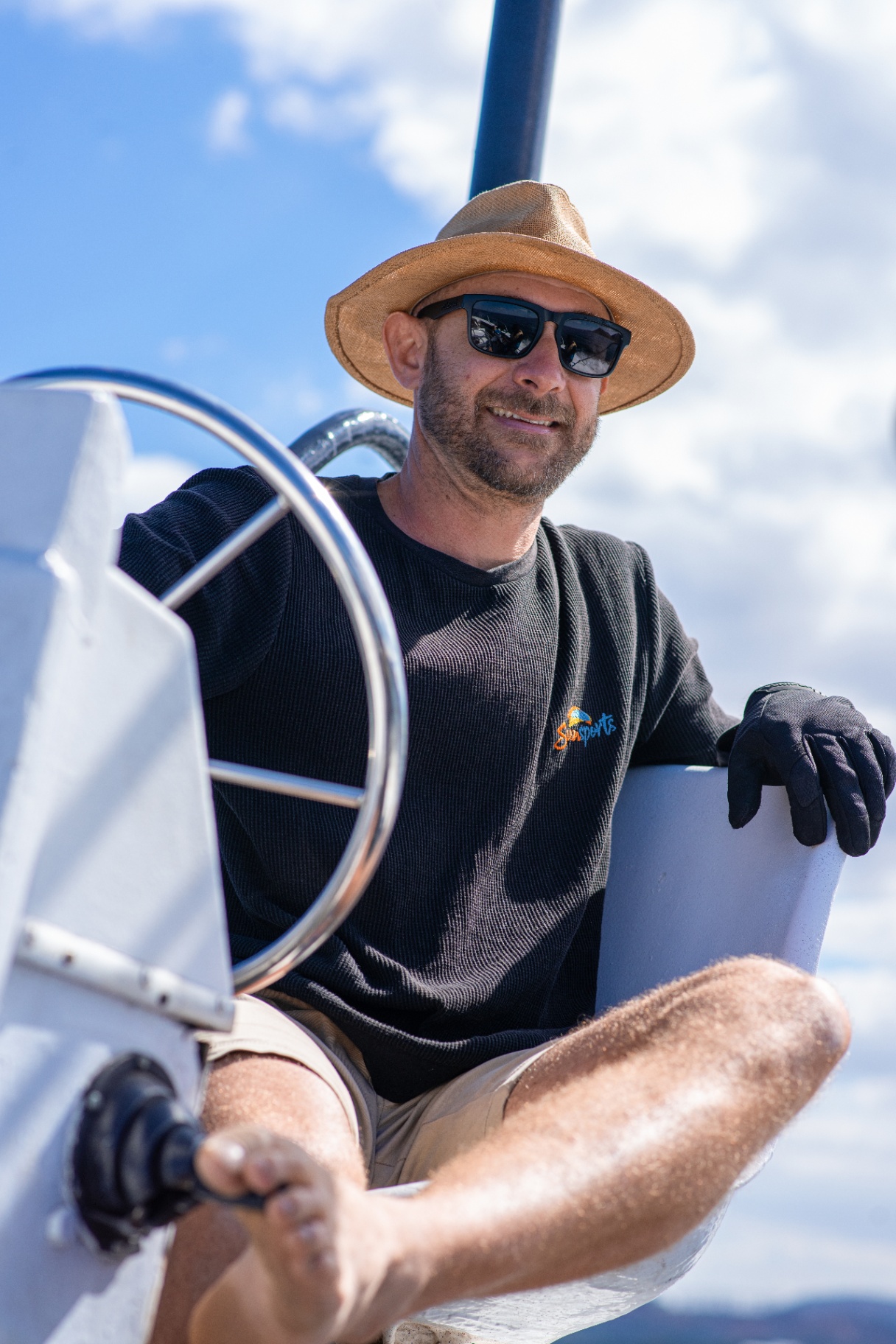Boat captain at the wheel
